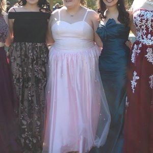 Pink dress in the middle.